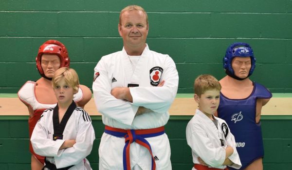 Karate instructor and his students